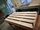 Assemblage des planches en frêne à l'atelier